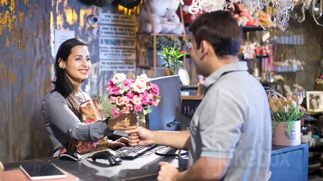 Customers want background music - a florist serving a customer in a shop with eJukebox music playing