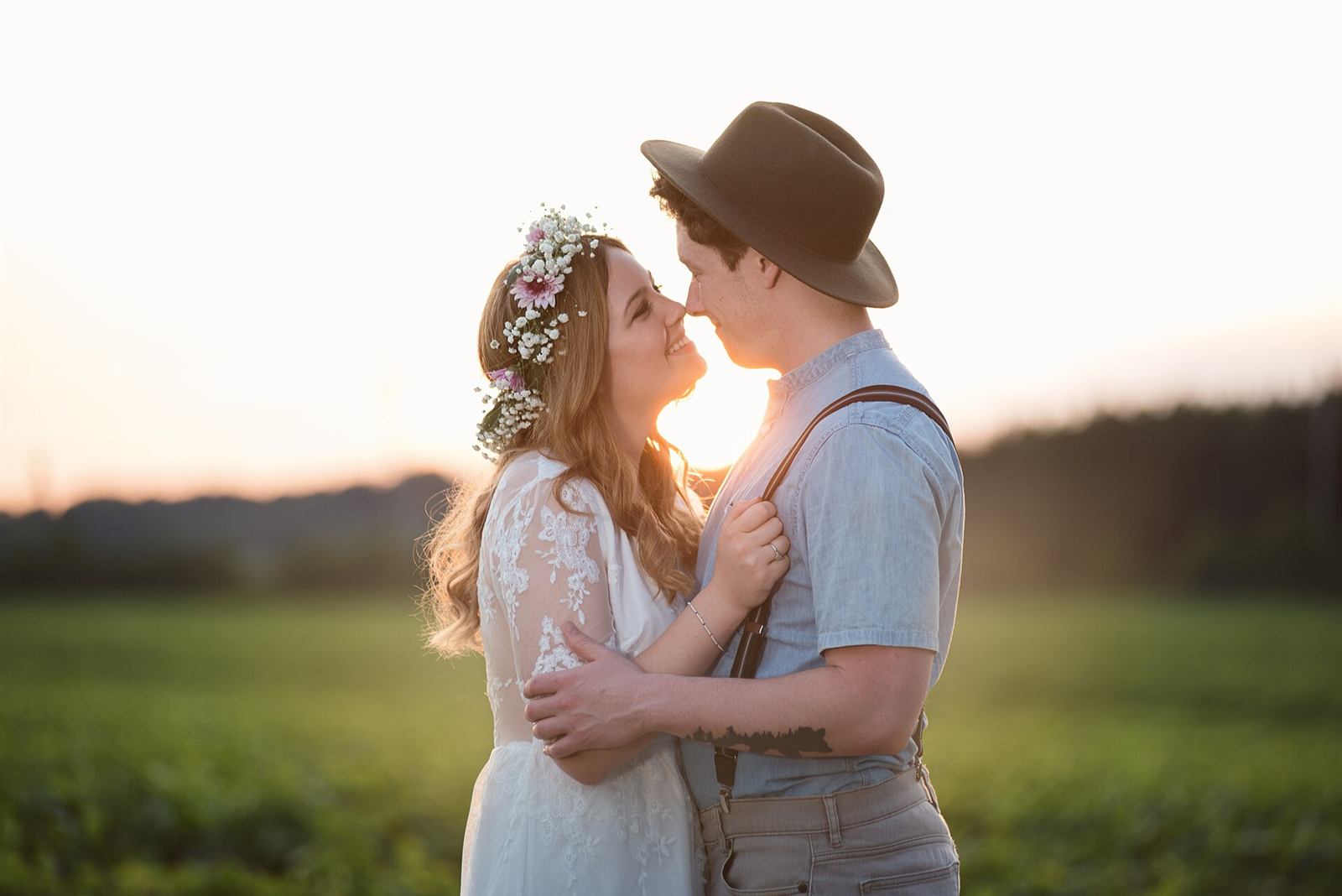 A couple laughing together at sunset